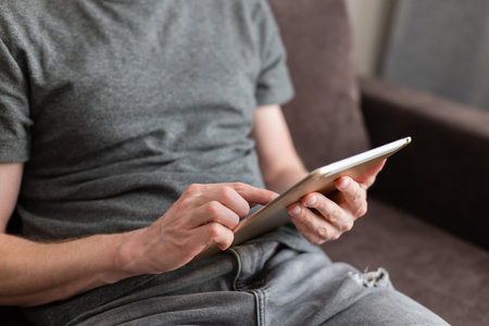 Point finger choose something on a tablet. Using technology.