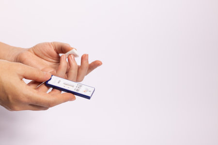 Hand holding rapid test for hepatitis. Negative test for hepatitis. Closeupの写真素材