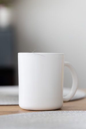 Animals hair on the cup on the kitchen table. Domestic animals during moult.