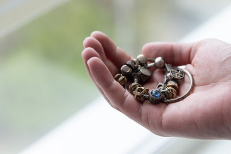 Man holding the oxidated jewellery. Closeup, selective focus.