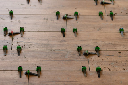 Tile Leveling System Components on The Floor. Closeup, selective focus.の写真素材