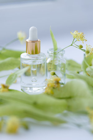 Linden extract in a small glass bottle. Selective focus.の写真素材