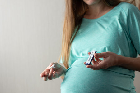 Pregnant woman makes rapid blood test for hepatitis.の写真素材