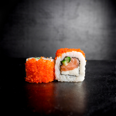 Sushi rolls on black background. Japanese foodの写真素材
