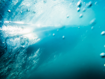 Wave underwater. Blue barrel waveの写真素材