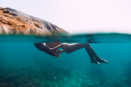 Woman relaxed in blue sea. Holidays at the oceanの写真素材