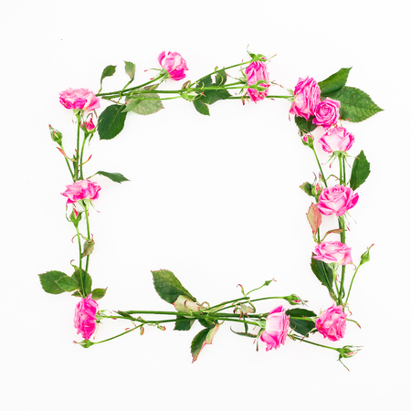 Floral square frame made of pink roses, branches and leaves on white background. Flat lay, Top view. Flower compositionの写真素材