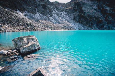 Beautiful blue alpine lake. Summer in the mountainsの写真素材