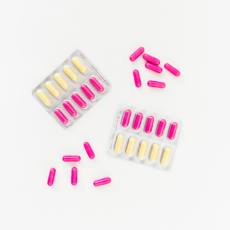 Healthy concept with vitamins on white background. Flat lay, top view. Medical concept