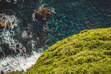 Ocean, waves and cliff in Uluwatu, Baliの写真素材