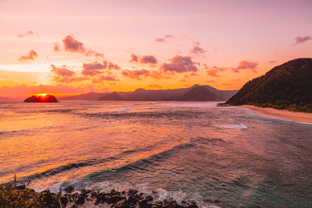 Ocean, coast and sunset with clouds. Sea with sunset colorsの写真素材