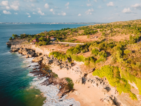 Aerial view of the secret sandy beach with ocean and rocks.の写真素材