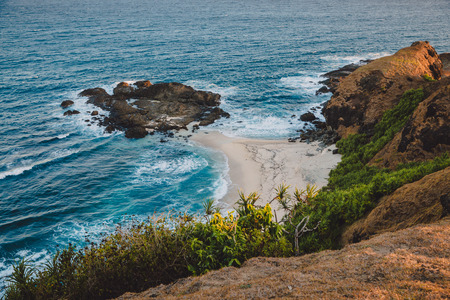 Rocky cape, beach and blue ocean with waves in Australiaの写真素材
