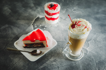 Sweet milkshake drink and berry desserts with cake.の写真素材