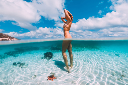 Beautiful woman in tropical oceanの写真素材