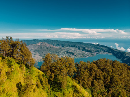 Aerial view of Batur volcano and lake with forest in Baliの写真素材