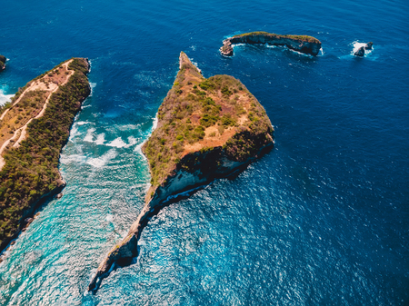 Paradise view with blue ocean and island in Nusa Penida. Aerial drone view