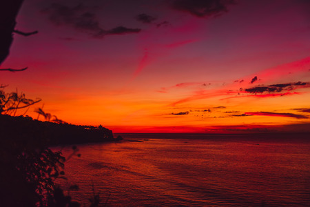 Bright colorful sunset in Bali with oceanの写真素材