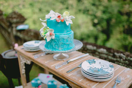 Wedding tasty cake with flowers and gifts. Wedding banquetの写真素材