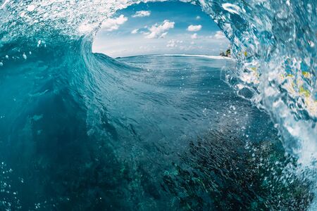 Barrel wave in ocean. Breaking blue waveの写真素材