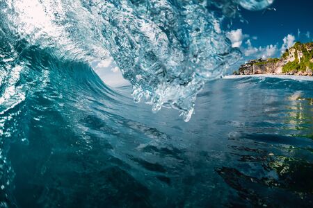 Crashing blue wave. Breaking barrel wave