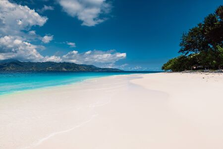 Paradise beach with blue ocean in tropical islandの写真素材