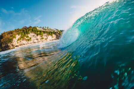 Breaking blue wave. Barrel wave for surfing.