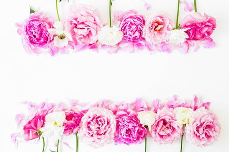 Frame of pink flowers on white background. Floral lifestyle composition. Flat layの写真素材