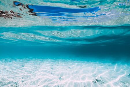 Blue ocean with white sand bottom underwater in Hawaiiの写真素材