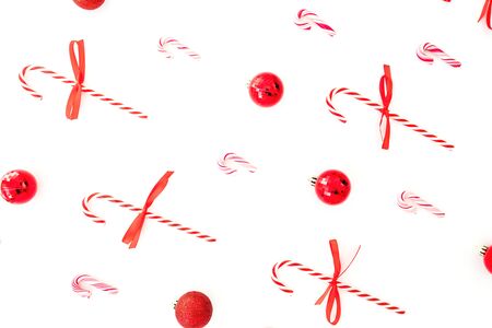 Christmas composition with decoration and candy cane isolated on white background. Flat lay, top view.の写真素材