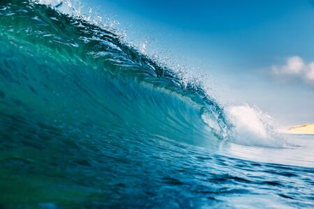 Barrel wave for surfing in ocean. Breaking transparent waveの写真素材