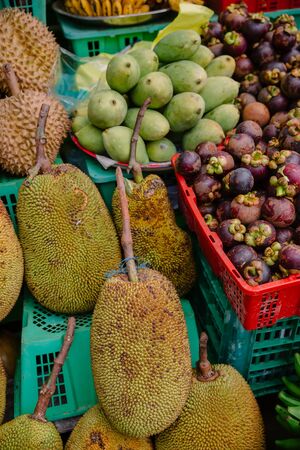 Fresh fruit market with mango, mangosteen and pineapple in Asia, Baliの写真素材
