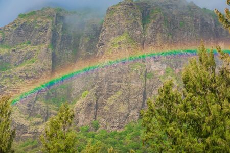 Colorful rainbow and Le Morn brabant mountainの写真素材