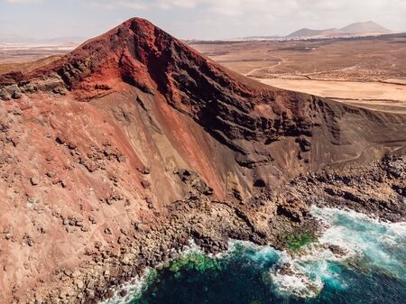 Volcanic crater with Atlantic ocean near La Santa, Lanzarote, Spain. Aerial viewの写真素材