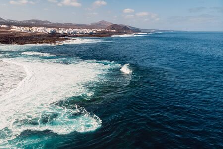 Aerial view of La Santa beach with ocean and village in Lanzarote, Canary islands