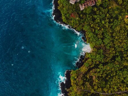 Blue ocean in tropical island with rocky coastline. Aerial view.の写真素材