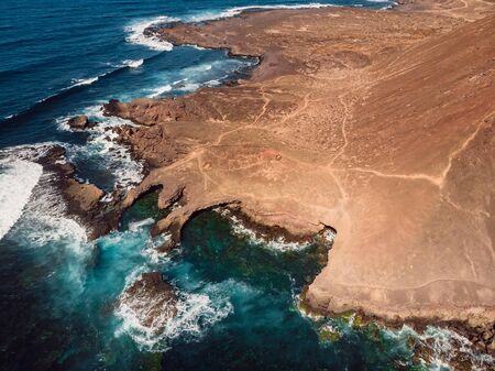 Aerial view of rocky coastline and blue ocean in Lanzarote, Canary Islands.の写真素材