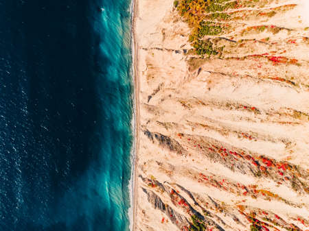 Aerial view of rocky coastline with cliff and sea. Top viewの写真素材