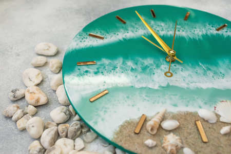 Wall clock with clock hands made of epoxy resin art