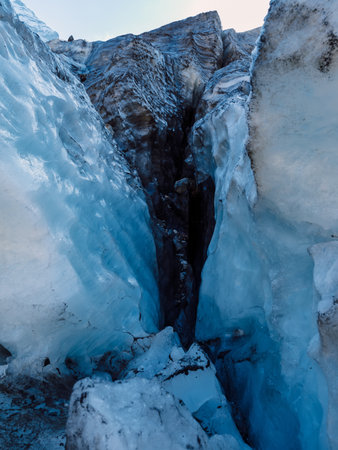 Glacier close up. Blue ice in mountains. Ice textures