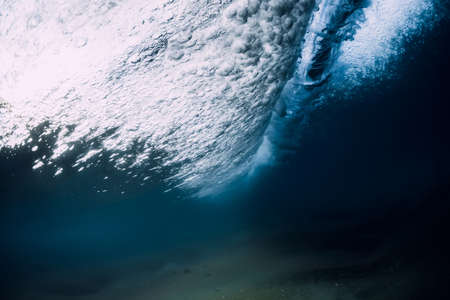 Ocean wave and vortex underwater with transparent water.の写真素材