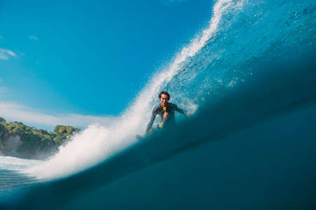 May 12, 2021. Bali, Indonesia. Indonesian Professional surfer Alik Rudiarta on surfboard at blue barrel wave.のeditorial素材