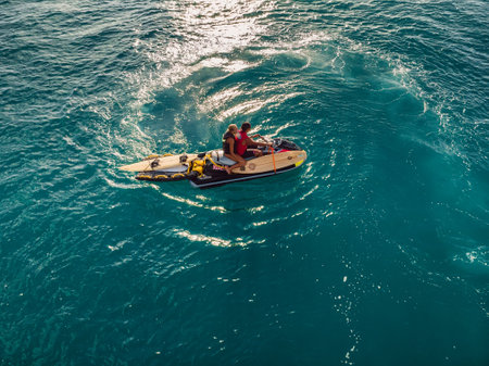 August 8, 2021. Bali, Indonesia. Aerial view with surfing on big barrel wave. Blue perfect waves and surfers in ocean at Padang Padangのeditorial素材