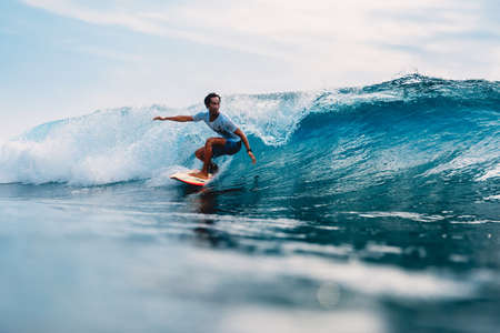 April 11, 2019. Bali, Indonesia. Indonesian surfer Alik Rudiarta training on surfboard at ocean wave.のeditorial素材