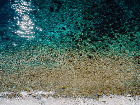 Aerial view of coastline with quiet transparent sea. Summer day on seaの写真素材
