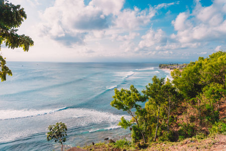 Big waves in blue ocean. Perfect waves for surfing and coastlineの写真素材