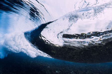Transparent ocean water and breaking wave in underwater