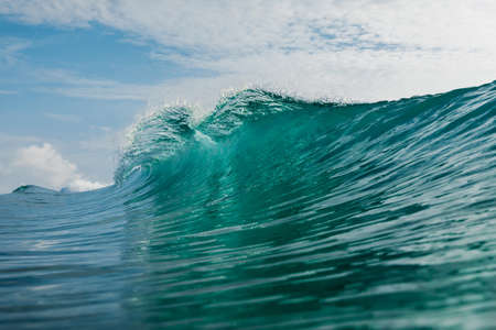 Ideal wave with transparent water in the Atlantic Ocean. Glassy turquoise wave sunny day