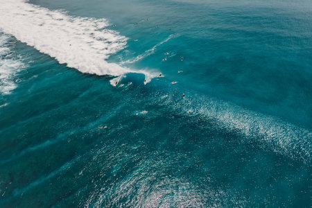 Aerial view with surfing on ideal wave. Perfect waves with surfers in ocean