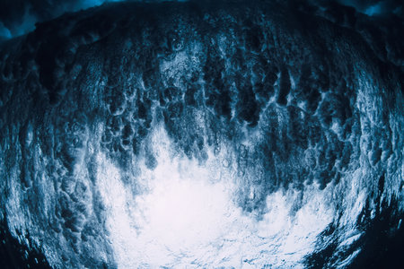 Wave textures with vortex underwater in transparent sea water. Swell in ocean